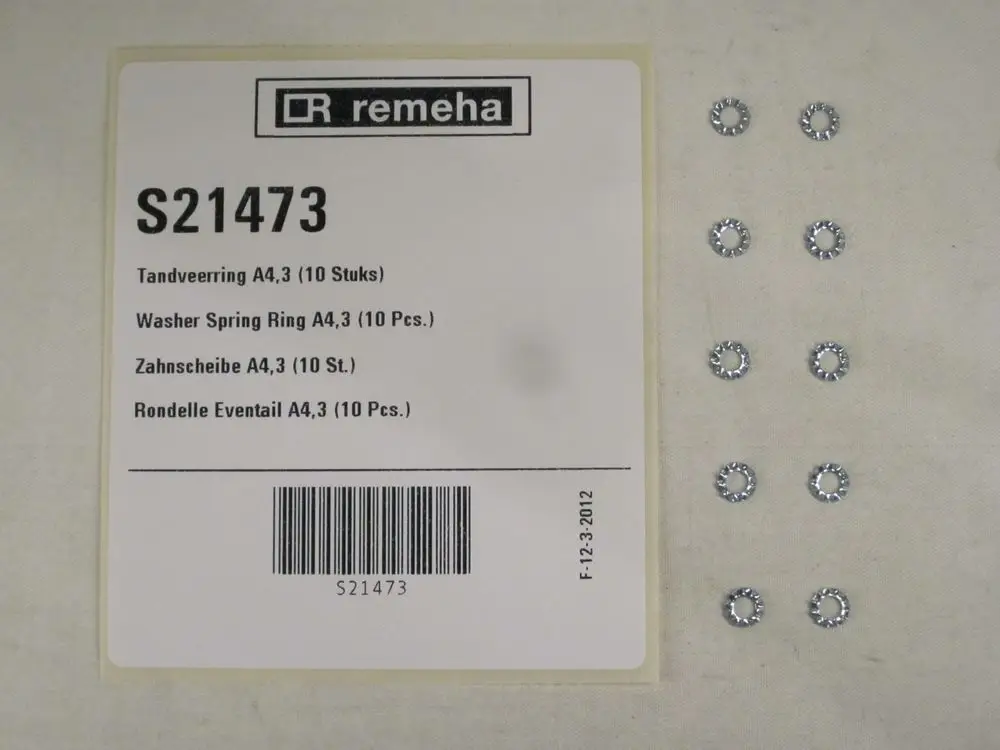 Mehrere zahnförmige Unterlegscheiben in Metall, angeordnet neben einer Produktverpackung mit Informationen von Remeha. Die Verpackung zeigt Stückzahl und Artikelnummer.